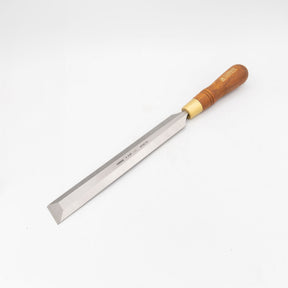 Woodworking chisel with beveled steel blade and wooden handle on white background
