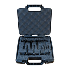 Black tool case with compartments holding Famag forstner bits on a white background