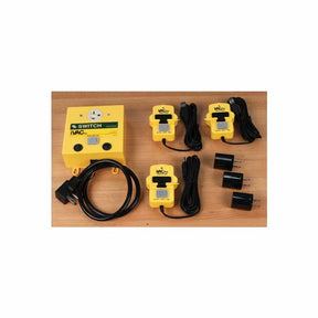 Workshop dust collection remote control switch kit with yellow modules and power cables on wood table