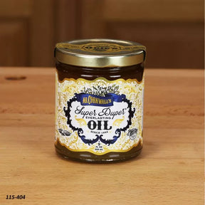 Jar of wood finishing oil on a wooden surface, labeled Super Duper Everlasting Oil.