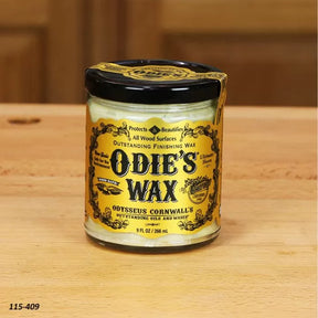 Odie's Wax jar for wood finishing on a wooden table, woodworking supplies.