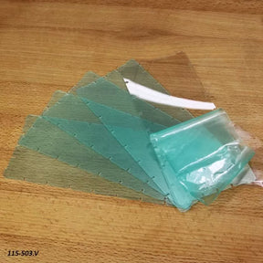 Clear plastic router table insert plates with protective film on a wooden surface