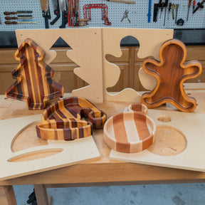 Christmas-themed wooden trays in tree, ornament, stocking, and gingerbread shapes with templates