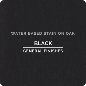 Black water-based wood stain sample on oak with visible grain texture