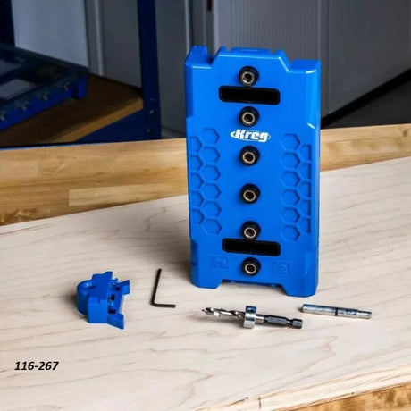 Kreg pocket hole jig kit with drill bit, wrench, and accessories on a woodworking bench
