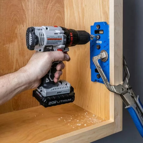 Drill and pocket hole jig used for cabinet joinery on wood furniture project