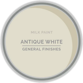 Antique white milk paint in a tin labeled General Finishes, woodworking paint color sample.