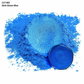 Dark ocean blue pigment powder with matching mixed resin sample in a container