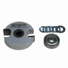 Woodworking slot cutter router bit set with bearings and shims on white background