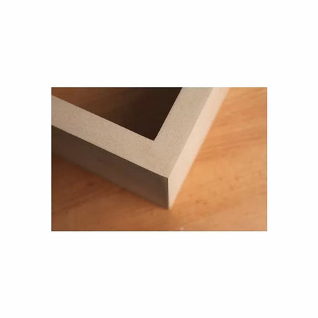 Close-up of a precisely cut mitered corner joint on MDF wood panel for woodworking projects