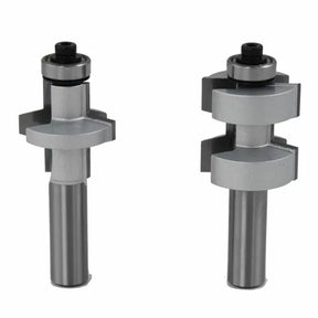 Two silver tongue and groove router bits for woodworking on white background