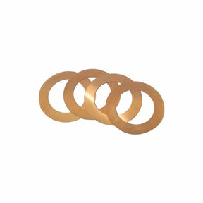 Set of four brass shims for woodworking tool alignment on white background