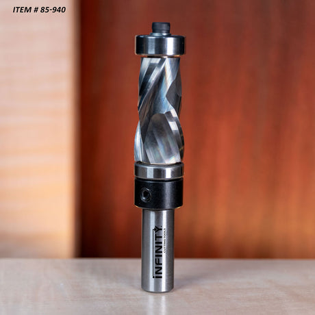 Helical carbide insert router bit for woodworking with sharp spiral blades on a table