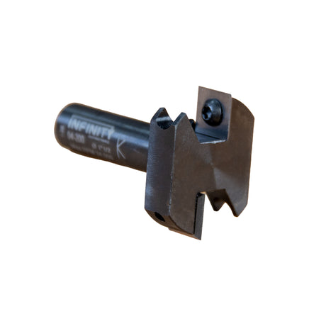 Infinity Tools Insert-Pro Mini Spoilboard Surfacing and Rabbeting Router Bit laying on its side at a three quarter angle showing the top and blades