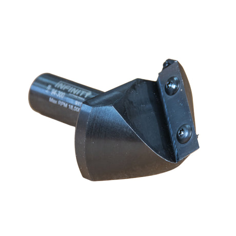 Infinity Tools Insert-Pro 91° Miterfold Router Bit laying on its side at a three quarter angle showing the bit blade and geometry.