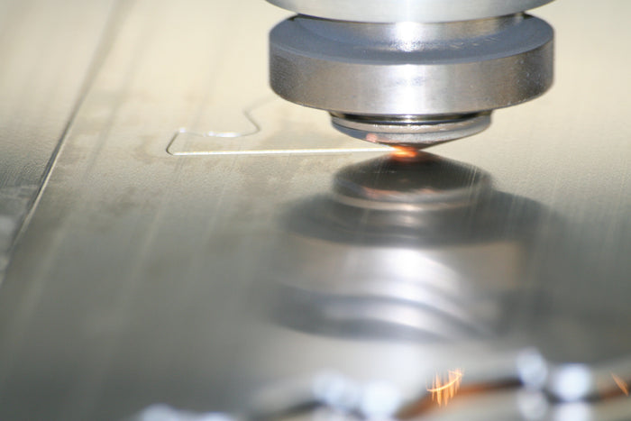 Close-up of a machine tool in operation with metal cutting
