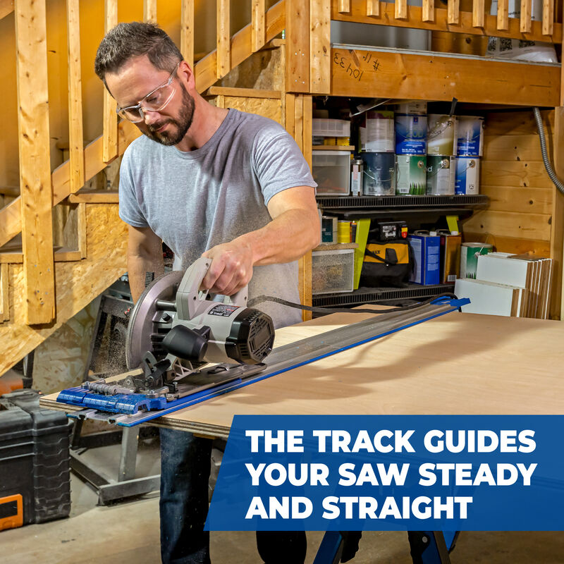 Man using a circular saw with a track guide in a workshop setting.