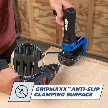 Person using a drill with a clamping device on a wooden surface, highlighting the Gripmaxx anti-slip clamping surface.