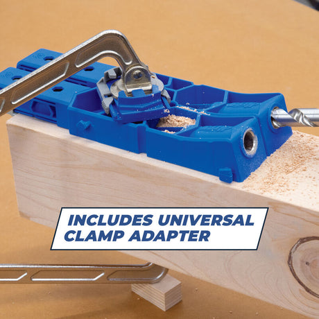 Pocket hole jig with universal clamp adapter attached to wood, drilling pocket holes