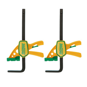 Pair of yellow and green woodworking clamps with quick-release handles