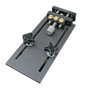 Adjustable router table micro fence jig with brass knobs and textured metal base.