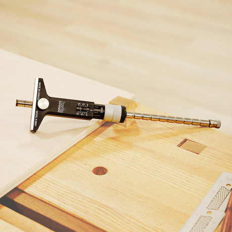 Wooden surface with a tool and a book