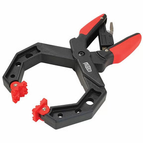 Adjustable woodworking corner clamp with red grips and rotating jaws for precise clamping