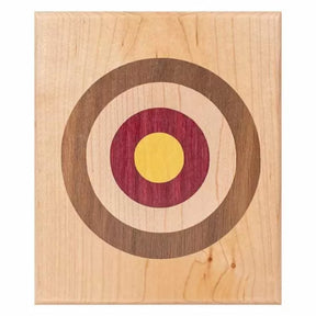 Wood inlay target pattern with concentric circles on a light rectangular panel