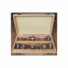 Open wooden router bit storage box with foam lid insert, displayed on a workbench