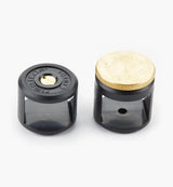 Pair of woodworking dowel gauge guides with black bases and brass tops on white background