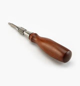Woodworking hand tool with metal shaft and polished wooden handle on white background