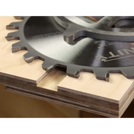 Dado saw blade cutting a precise groove in plywood for woodworking