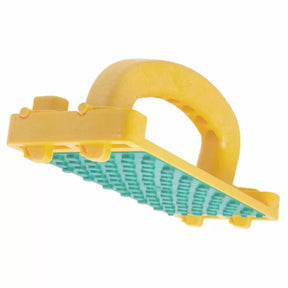 Yellow plastic woodworking push block with green textured grip surface