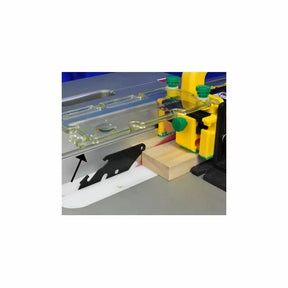 Table saw setup with push block, riving knife, and wood piece for safe woodworking