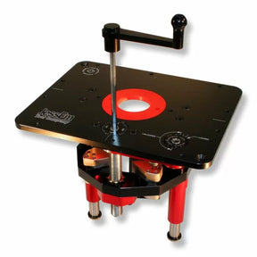 Router lift for woodworking with black top plate, red accents, and crank handle