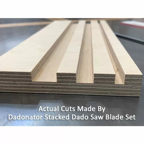 Close-up of plywood with multiple dado cuts made by stacked dado saw blades on a workbench