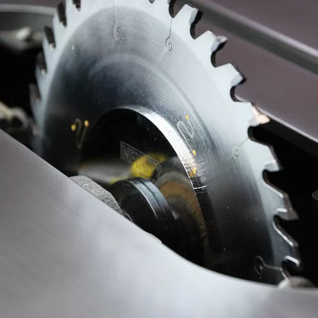 Close-up of circular saw blade in table saw, ideal for precision woodworking cuts