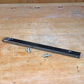 Router miter bar with screws on a woodworking bench for router table setup