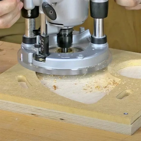 Plunge router cutting precise shapes in MDF wood with sawdust on workbench