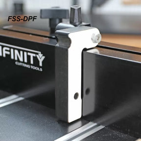 Router table fence stop accessory attached to a black router table fence